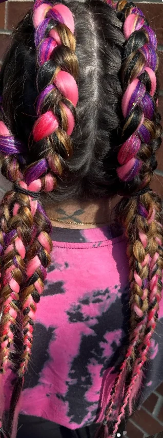 Pink, purple, black, and blonde braided hair result by Gypsy Cosmo Salon
